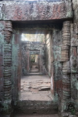 Fototapeta na wymiar old, broken, crumbling passage with pillars in ancient angkor wat temple, cambodia, asia, home to khmer civilisation