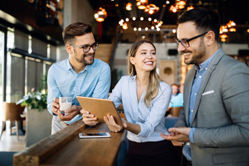 Business colleagues having conversation during coffee break