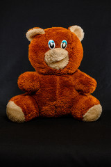 Teddy bear old teddy bear on a dark background.