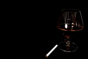 Glass of dark red brandy,   whiskey or bourbon