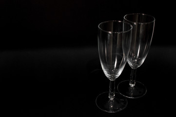 Empty сhampagne glass on black background