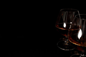 Glass of dark red brandy,   whiskey or bourbon