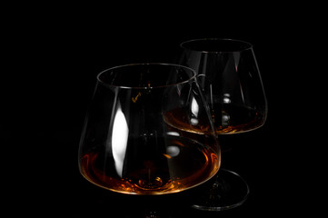 Glass of dark red brandy,   whiskey or bourbon