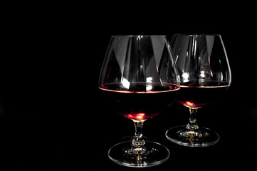 Glass of dark red brandy,   whiskey or bourbon
