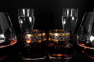 Glasses with different drinks brandy, whiskey, champagne or bourbon