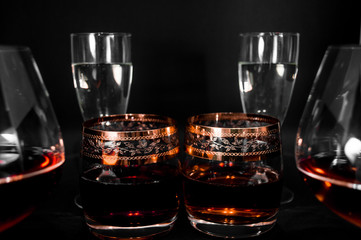 Glasses with different drinks brandy, whiskey, champagne or bourbon