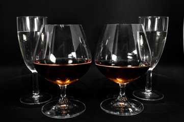 Glasses with different drinks brandy, whiskey, champagne or bourbon