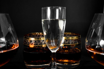 Glasses with different drinks brandy, whiskey, champagne or bourbon