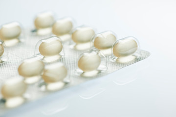 Foil packaging for tablets yellow with reflexion