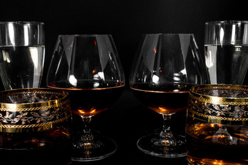 Glasses with different drinks brandy, whiskey, champagne or bourbon