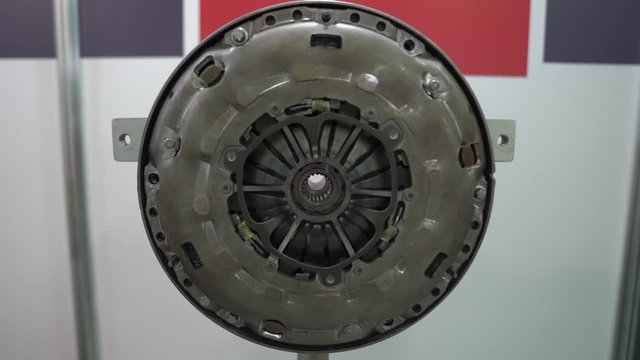 Flywheel of car engine repairs at service station internal parts of machine vehicle motor camera movement