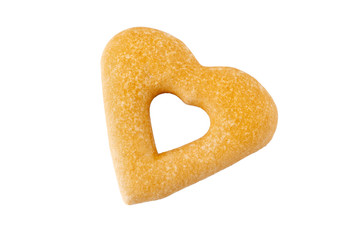 Tasty gingerbread in the shape of a heart and a cutout in the middle isolated on white. Sweet cookies, Christmas tree decoration.