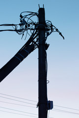 Electric pole with wires and power equipment