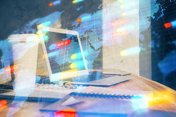 Double exposure of desktop computer and technology theme hologram. Concept of software development.
