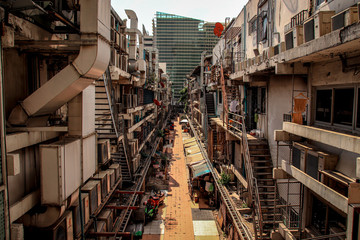 Crowded alley way in the slums of Bangkok City showing poverty and the reality of life in the city...