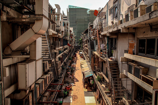 Crowded alley way in the slums of Bangkok City showing poverty and the reality of life in the city of Thailand