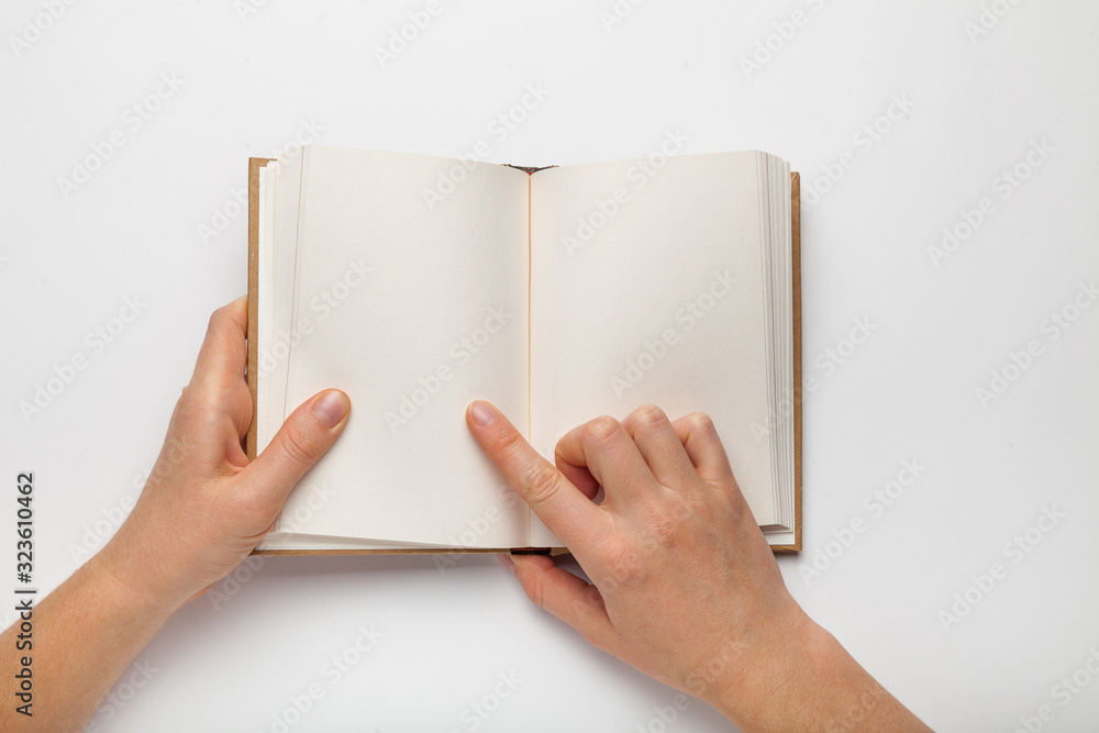 Poster a5 open book mockup with hands. empty template of page. blank for design. isolated on white backgrou