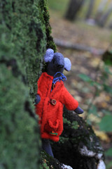 Grey handmade mouse in the red coat
