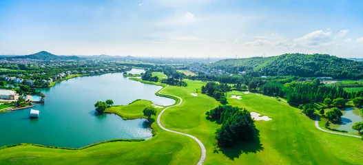 Deurstickers Aerial view of a beautiful green golf course in Shanghai,panoramic view. © ABCDstock