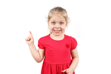 Little girl in a pink dress shows a finger. Concept for advertising. The child shows to pay...