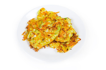 Savory cabbage pancakes on dish on a white background