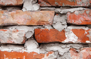 Old red brick wall close-up.