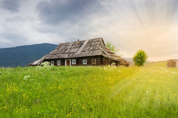 Fototapeta na wymiar Old abandoned rural wooden house in the Carpathian mountains