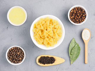 Ingredients for cooking pasta: butter, allspice, cloves, bay leaves, black pepper, salt. Healthy eating concept