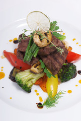 Grilled meat on grilled vegetables.
