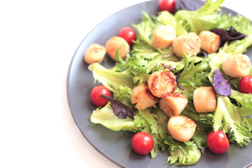 Seafoods - Shrimps, Sea Scallops, Squids and Salmon. Garnished with Fresh Raw Salad Leaf.