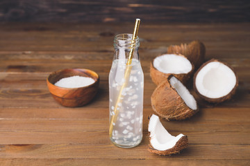 Bottle of fresh coconut water on table