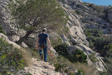 Fototapeta premium Back view of rock climber in Spanish mountains.