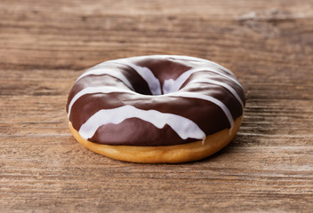 single doughnut on wooden table