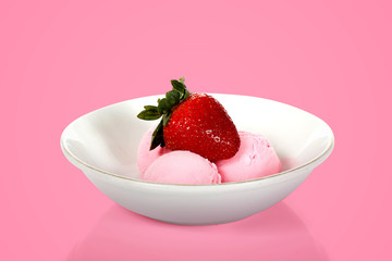 Ice cream with a strawberry on the bowl in vibrant color