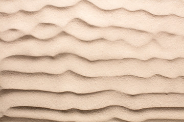 Fototapeta na wymiar top view of blank sand dunes on beach as textured background