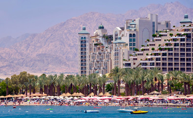 Sunny day on central public beach in Eilat - famous tourist resort and recreational city in Israel