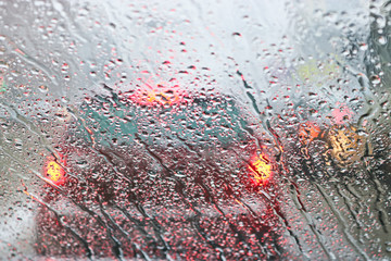 View from the car windscreen during rain and wet snow. Poor visibility while driving around the...