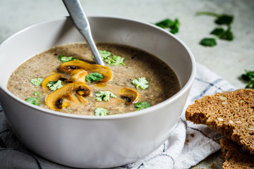 Mushroom soup puree with cilantro. Healthy vegetarian food concept.