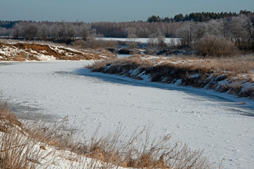 landscape of  winter river under ice