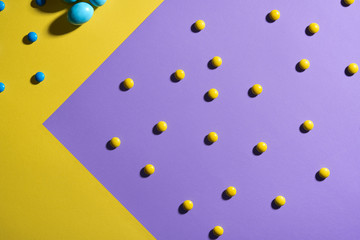 Two colored paper sheets with easter candies