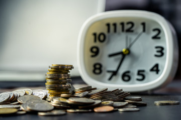 Medal Ladder Starting Business Growth.Financial concepts Creating a silver coin with investment alarm clock, saving money. Most of the time looking for money. Coins stack and alarm clock.