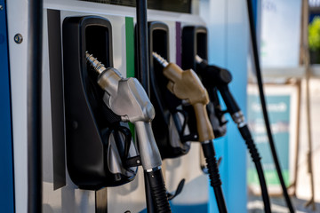Colorful Petrol pump filling nozzles, Gas station in a service.