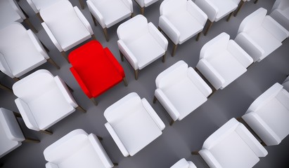 Concept or conceptual red armchair standing out in a  conference room as a metaphor for leadership, vision and strategy. A  3d illustration of individuality, creativity and achievement