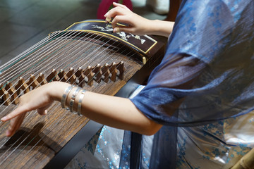 Women are playing zither, Chinese instruments