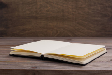 notepad or paper book at wooden table