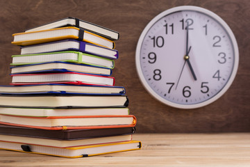 notepad or paper notebook at wooden table background
