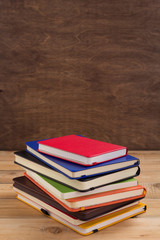 notepad or paper notebook at wooden table