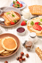 collection of crepe, waffle and pancake with chocolate, and strawberry