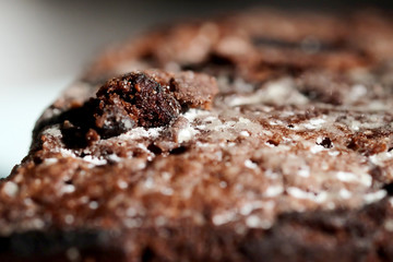 Homemade chocolate cake in white dish and sunlight and space for write wording, unhealthy sweet caused dangerous chronic illness such as diabetes, popular sweet sold in restaurant.