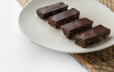 Vegetarian gluten-free chocolate energy bar on white background
